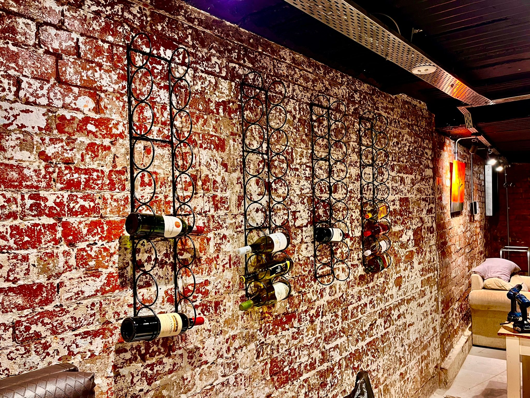 DG Technologies heritage showroom wine racks and restored brickwork