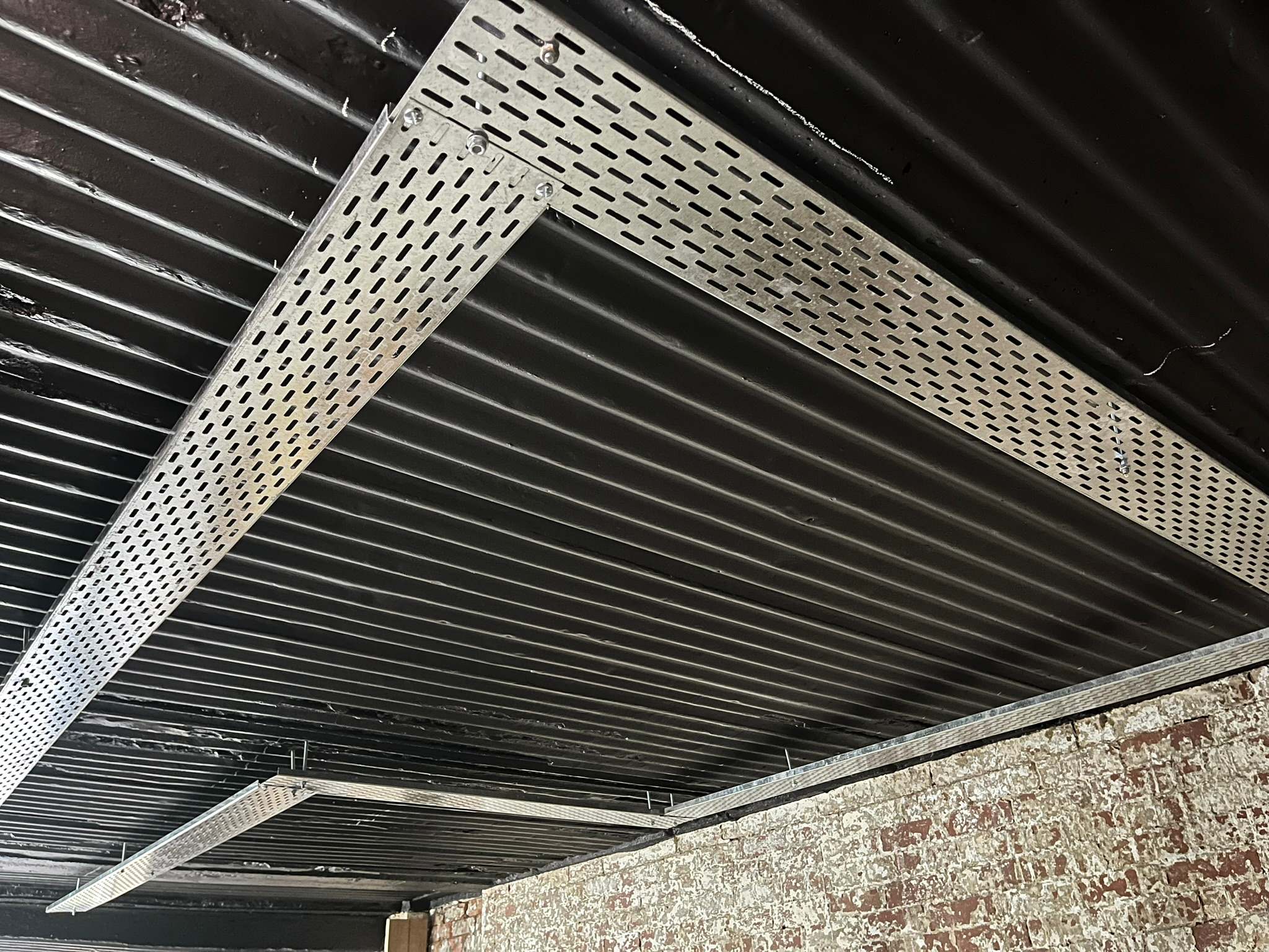 DG Technologies heritage entertainment room build detail: Exposed Cable Trays Being Installed