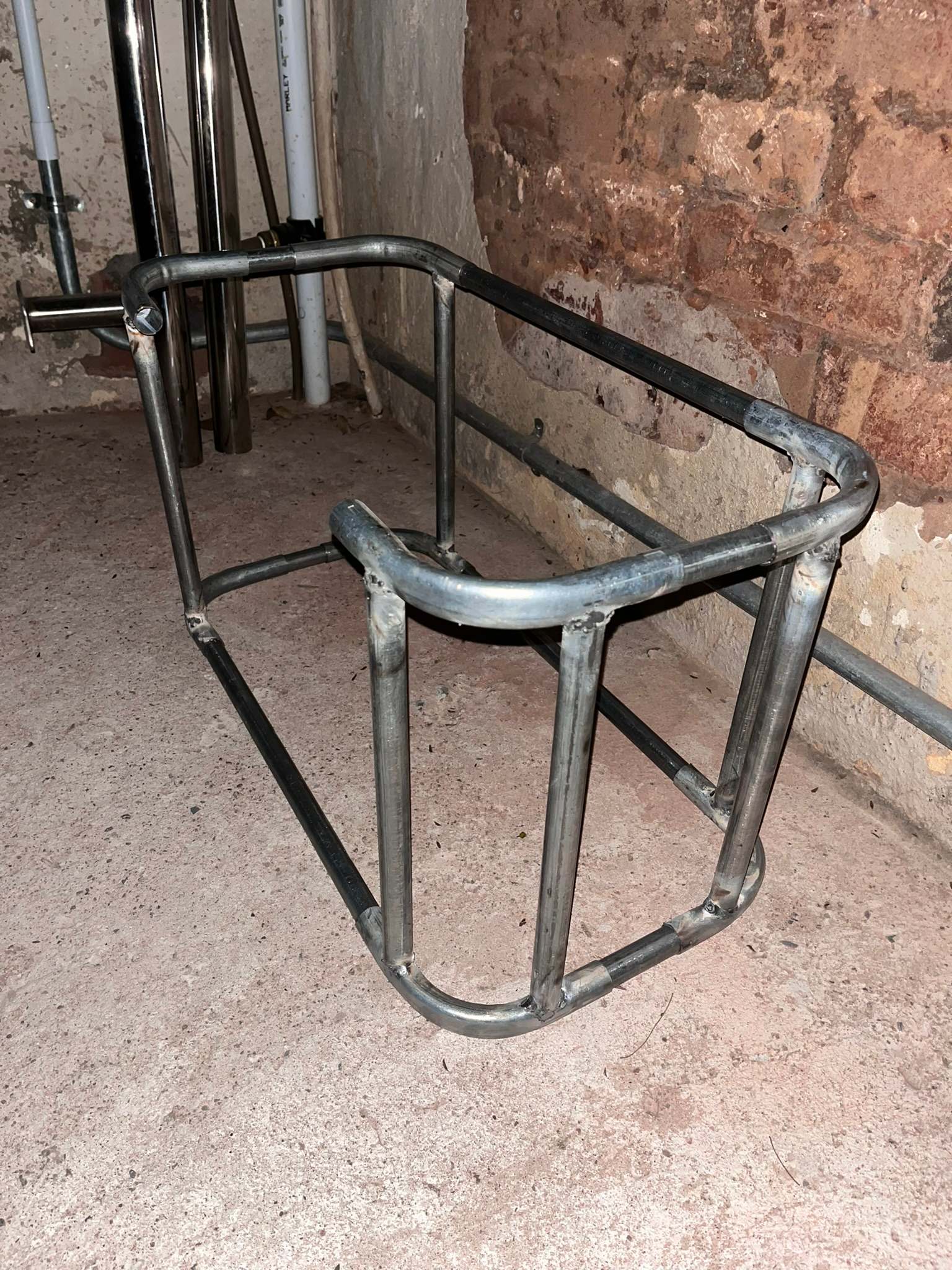 DG Technologies heritage entertainment room build detail: Welding the Glass Rack at Night