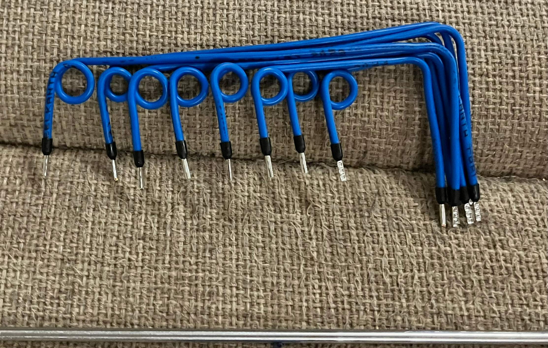 Hand-wound relay return wires prepared for a Crestron lighting control panel