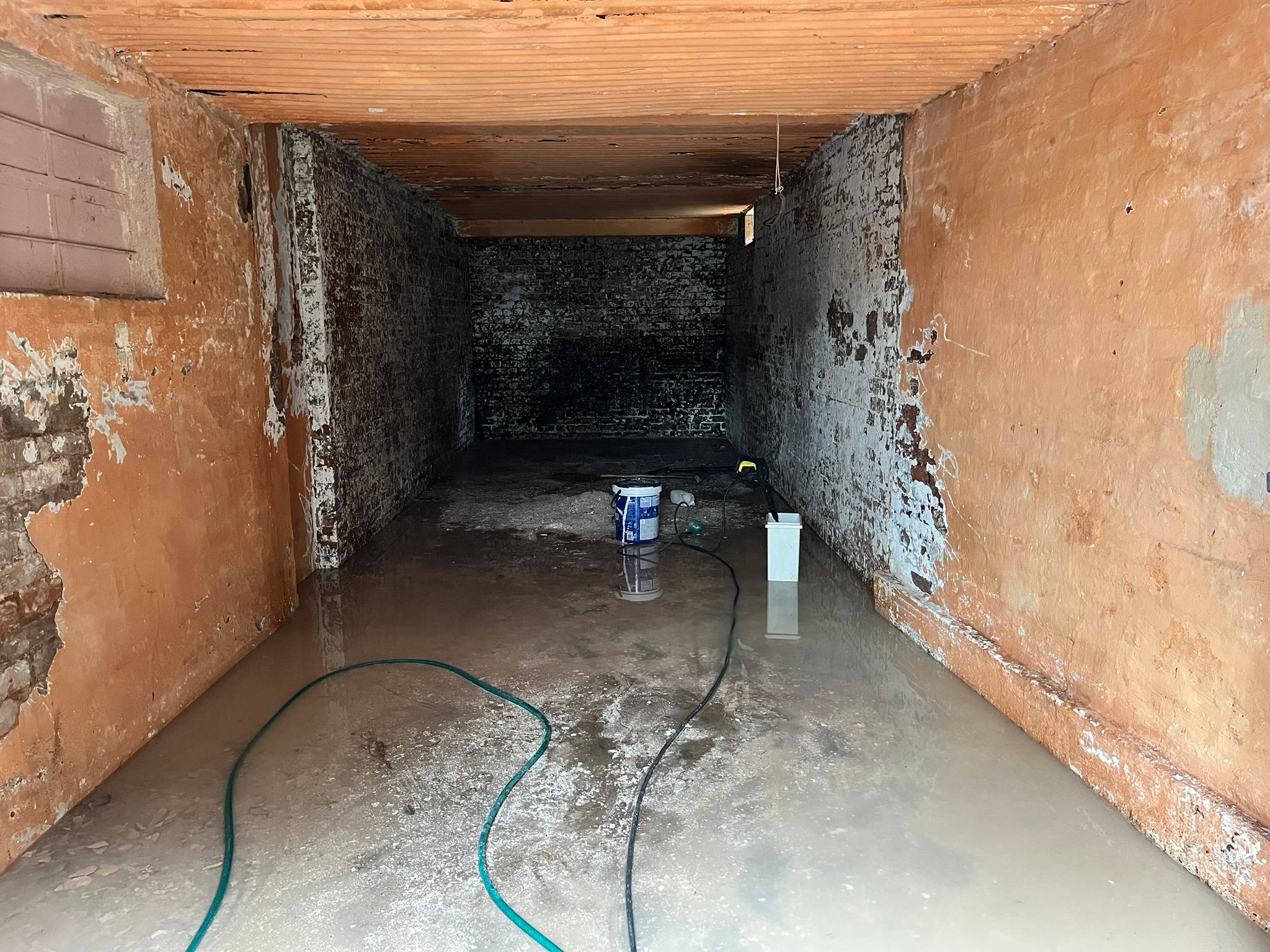 The original cellar space before restoration and entertainment room construction