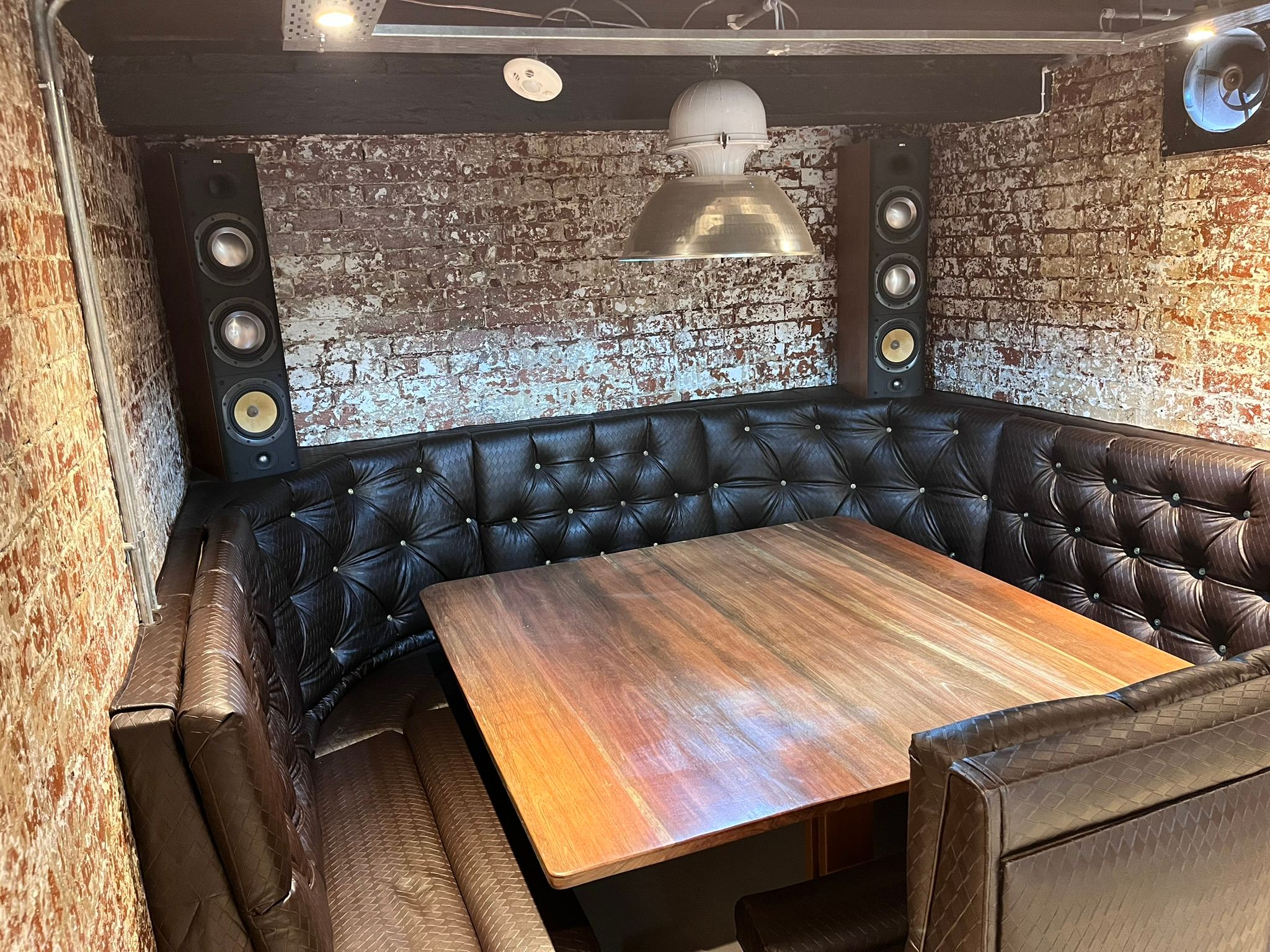 Motorised couch positioned for meeting mode in the entertainment room